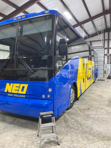 Full color change wrap with added yellow graphics (the bus was purple before it was wrapped).